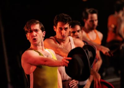 Connor Coughlin as Don (foreground), Anthony DaSilva as Mike, Adam Mandala as Greg, and Michael Bingham as Al in The REV Theatre Company’s production of A CHORUS LINE at the Merry-Go-Round Playhouse in Auburn, NY.